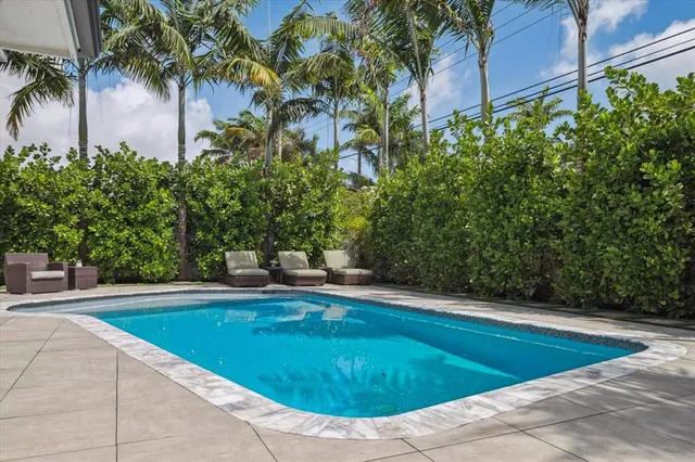 a view of a swimming pool with a patio