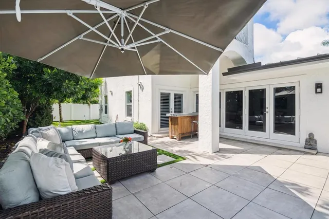 a swimming pool with outdoor seating and yard