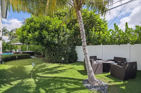an aerial view of multiple houses with yard