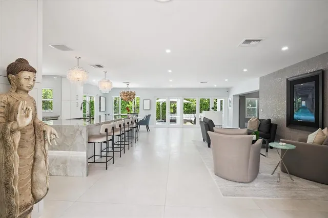 a view of a dining room with furniture floor and a chandelier