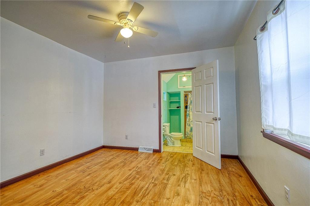 224 Roberts Road Plum, PA 15239 - Photo 13 of 25 a view of empty room with window and ceiling fan