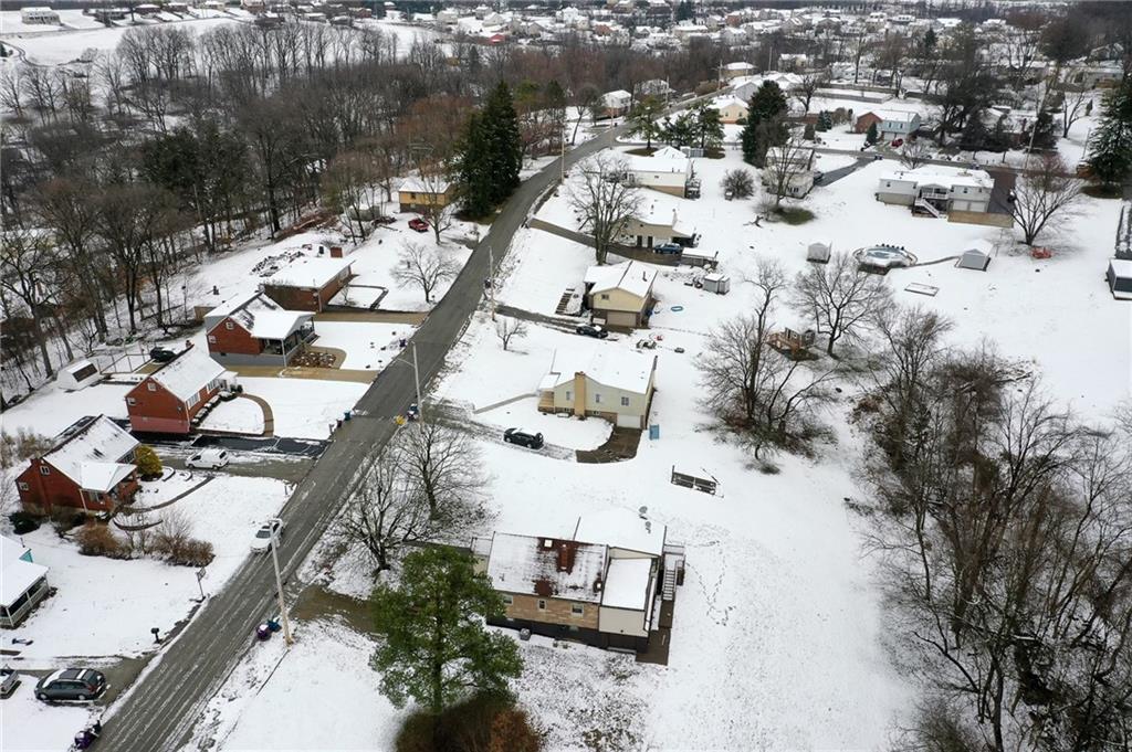224 Roberts Road Plum, PA 15239 - Photo 25 of 25 an aerial view of a house with a yard and lake view in back
