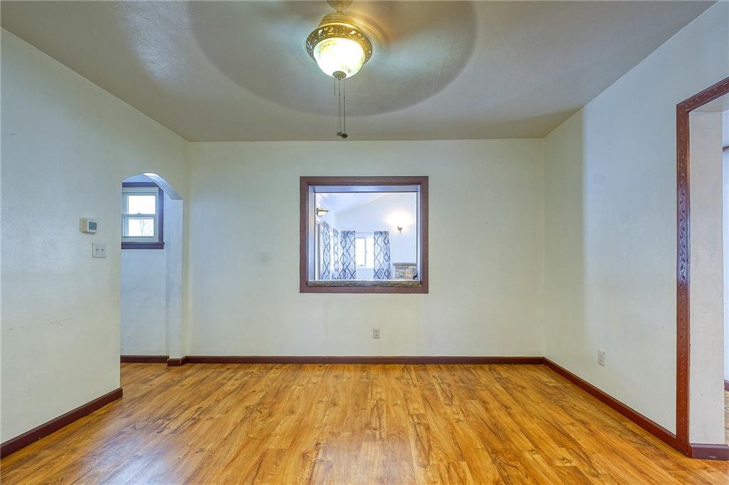 224 Roberts Road Plum, PA 15239 - Photo 8 of 25 a view of an empty room with wooden floor and a window