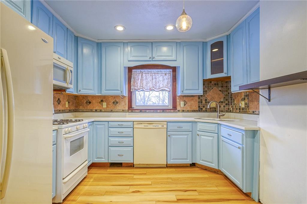224 Roberts Road Plum, PA 15239 - Photo 9 of 25 a kitchen with stainless steel appliances granite countertop a stove and white cabinets