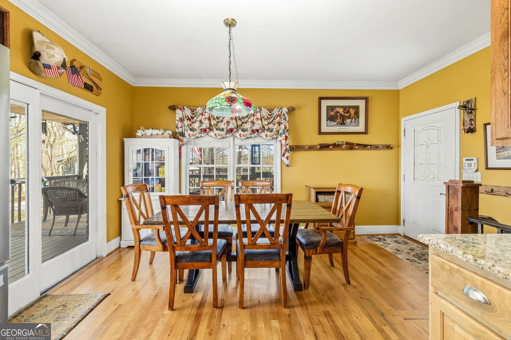 401 Herrin Road Cornelia, GA 30531 - Photo 16 of 83 a view of a dining room with furniture a chandelier and wooden floor