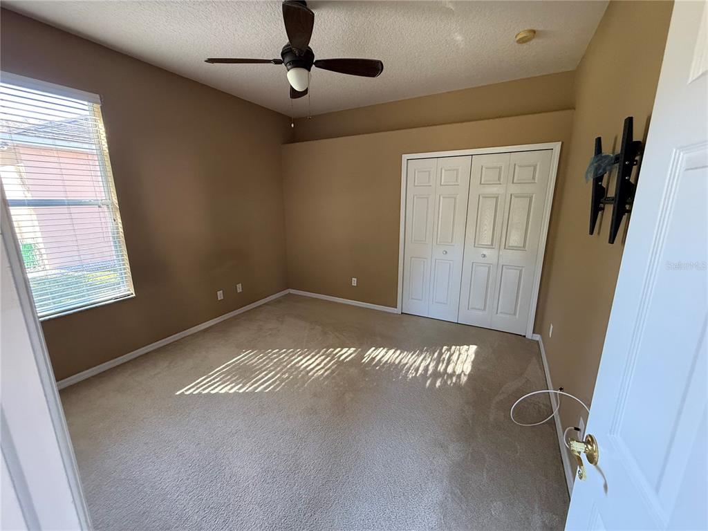 3231 Pawleys Loop North St. Cloud, FL 34769 - Photo 21 of 34 a view of an empty room with a window