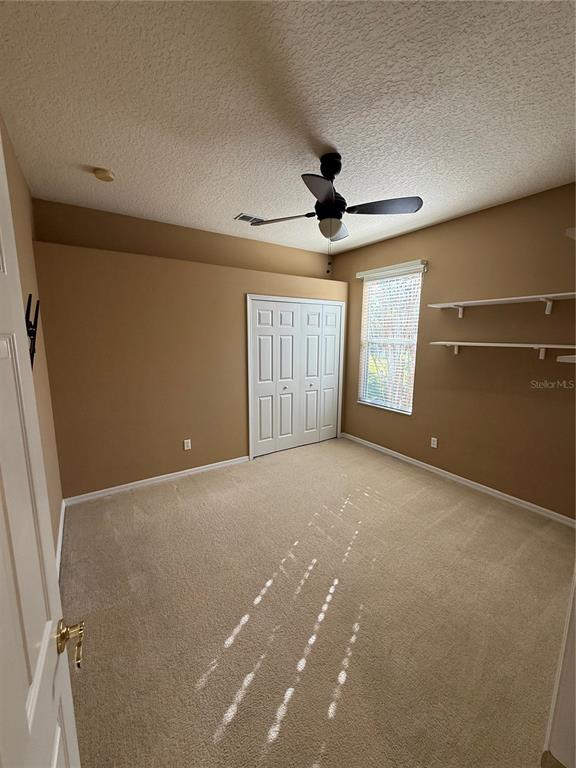3231 Pawleys Loop North St. Cloud, FL 34769 - Photo 23 of 34 a view of an empty room with a window