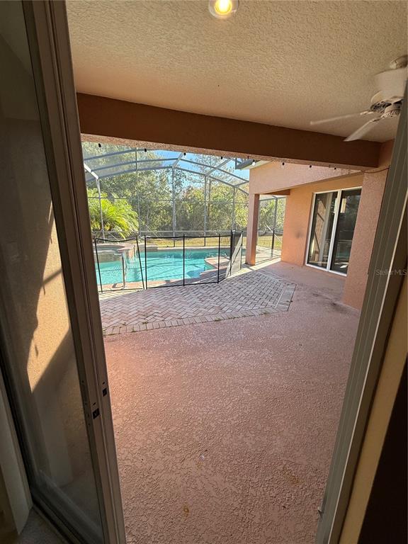 3231 Pawleys Loop North St. Cloud, FL 34769 - Photo 34 of 34 a view of an empty room with a fireplace and a large window