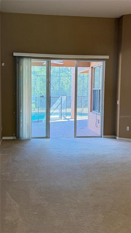 3231 Pawleys Loop North St. Cloud, FL 34769 - Photo 6 of 34 a view of an empty room with a window