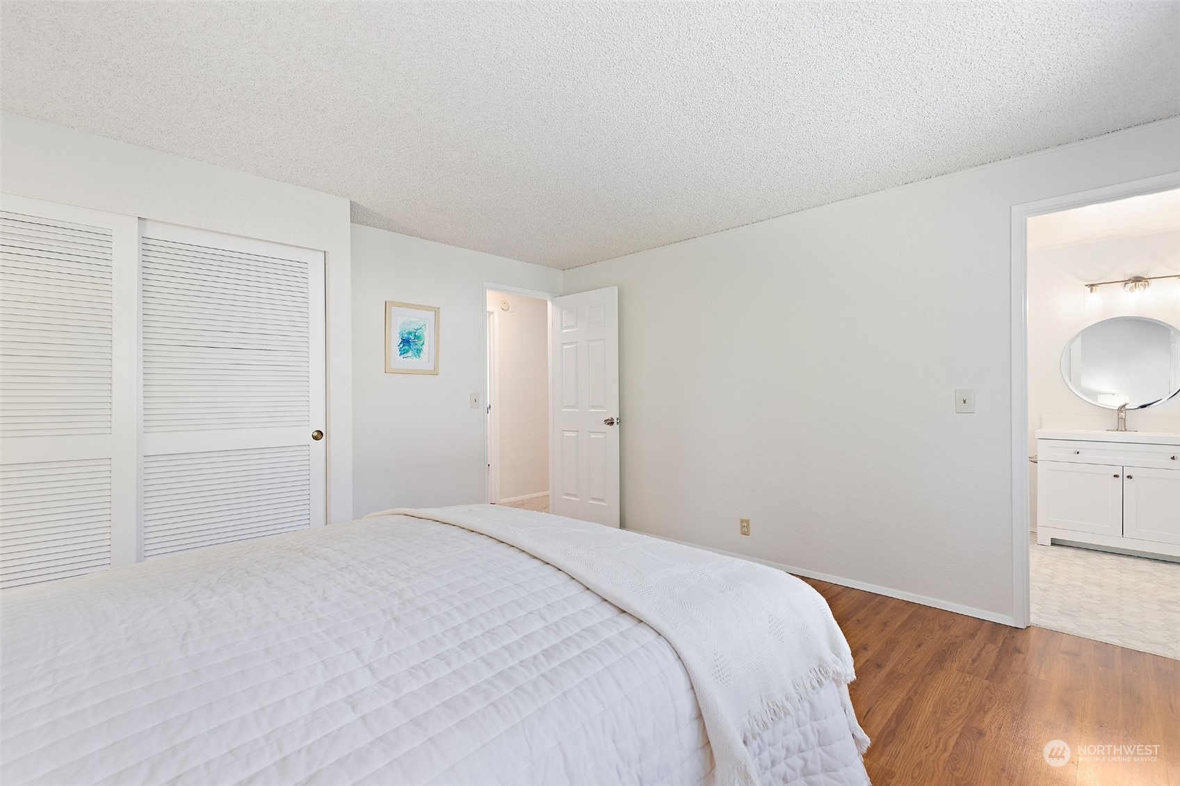 1229 206th Street Southeast Bothell, WA 98012 - Photo 15 of 40 a view of a bedroom with wooden floor