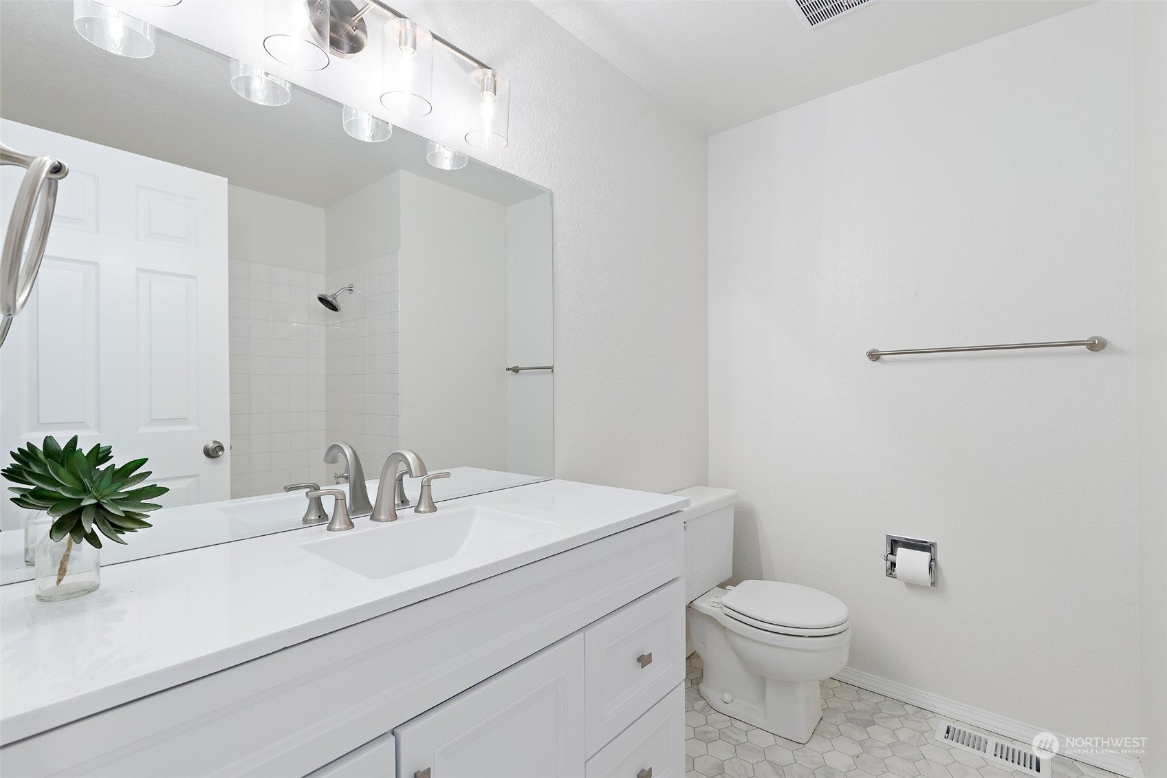 1229 206th Street Southeast Bothell, WA 98012 - Photo 19 of 40 a bathroom with a sink a toilet and a mirror