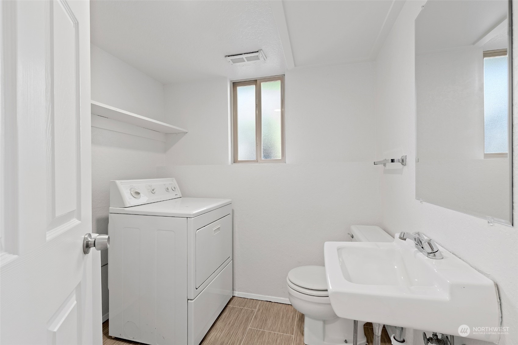 1229 206th Street Southeast Bothell, WA 98012 - Photo 25 of 40 a bathroom with a sink toilet and window