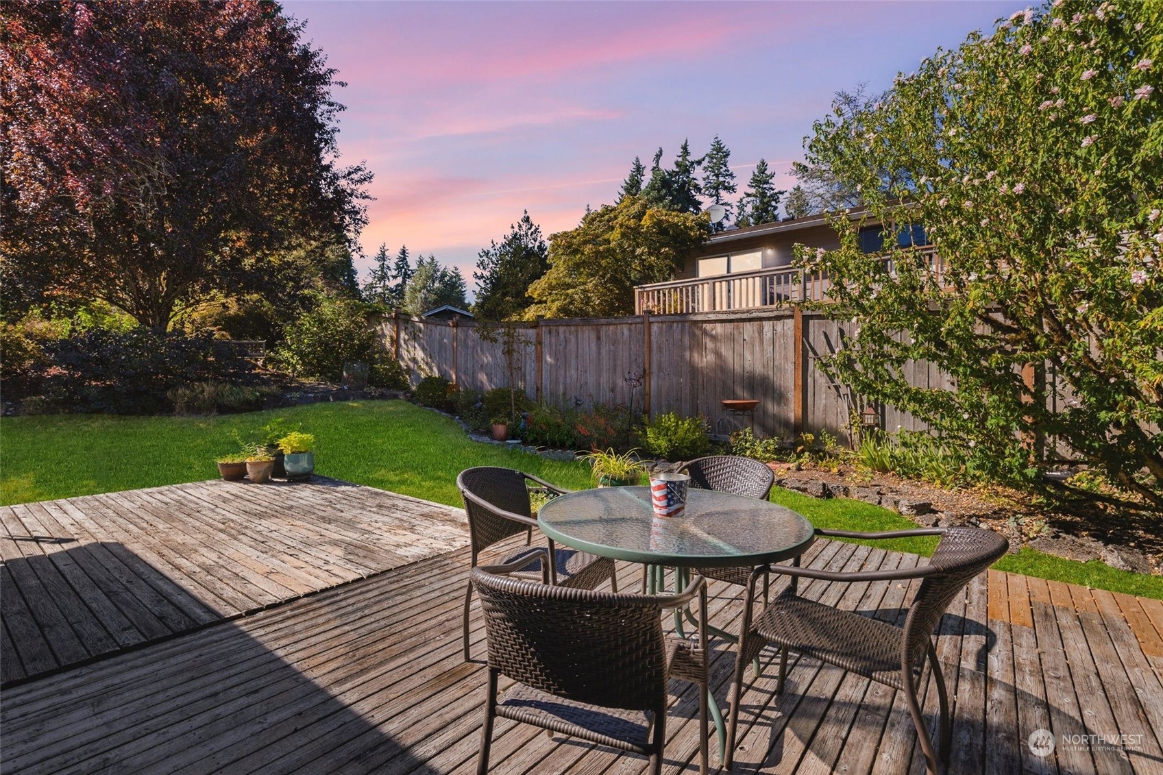 1229 206th Street Southeast Bothell, WA 98012 - Photo 29 of 40 a view of a table and chairs on the roof deck