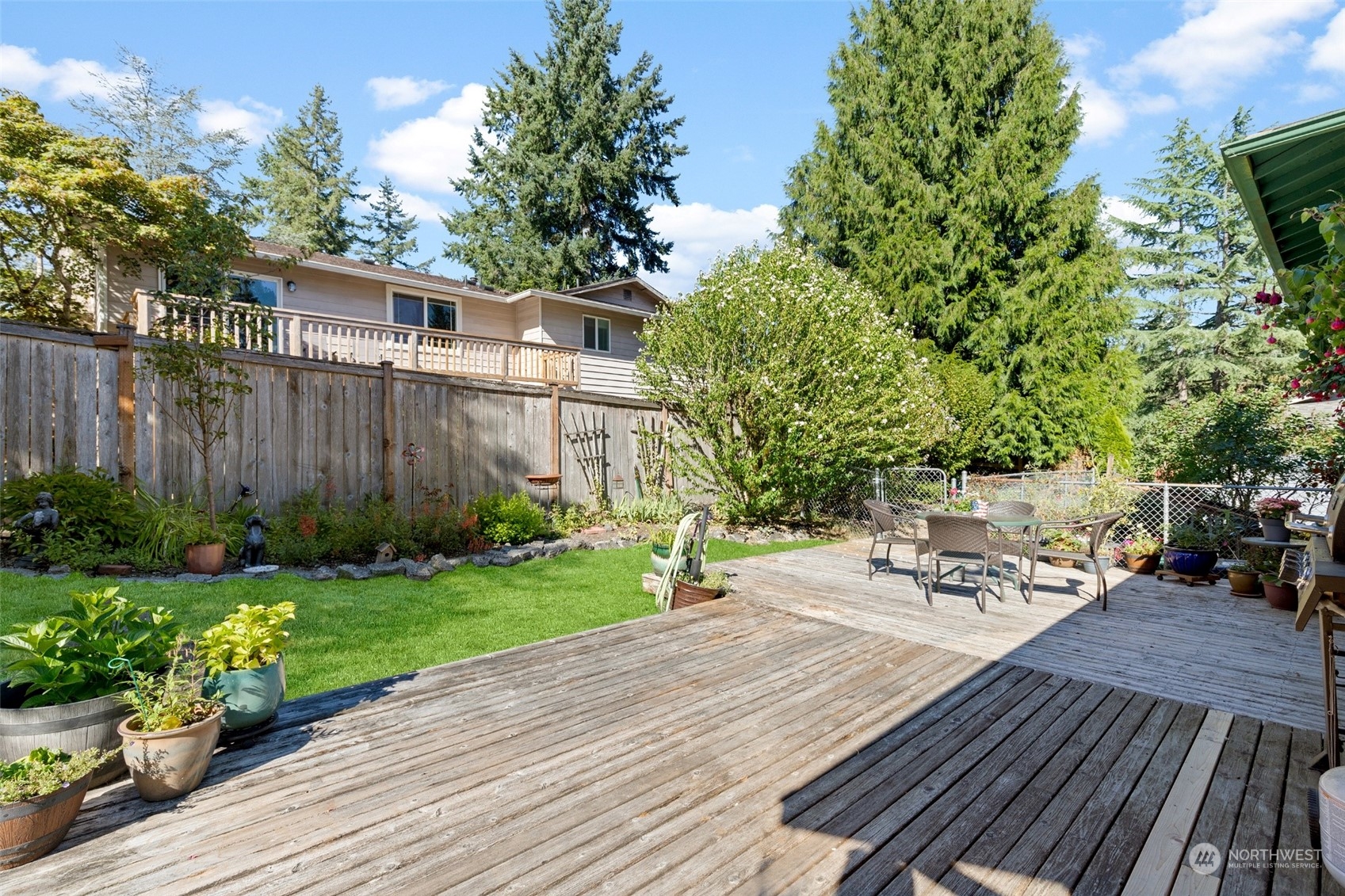 1229 206th Street Southeast Bothell, WA 98012 - Photo 30 of 40 a view of a backyard with sitting area