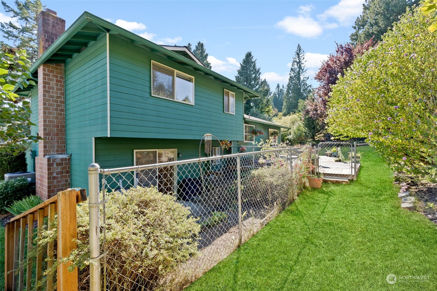 1229 206th Street Southeast Bothell, WA 98012 - Photo 32 of 40 a front view of house with yard and trees