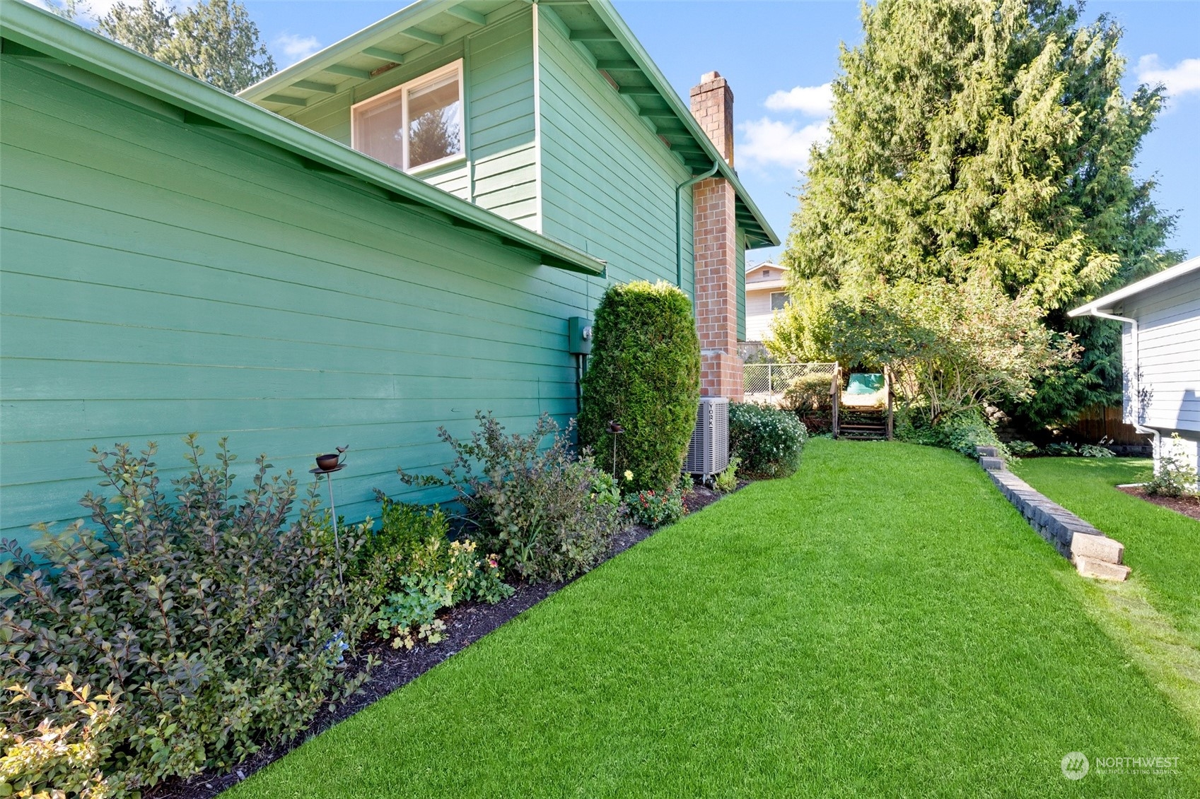 1229 206th Street Southeast Bothell, WA 98012 - Photo 33 of 40 a backyard of a house with lots of green space