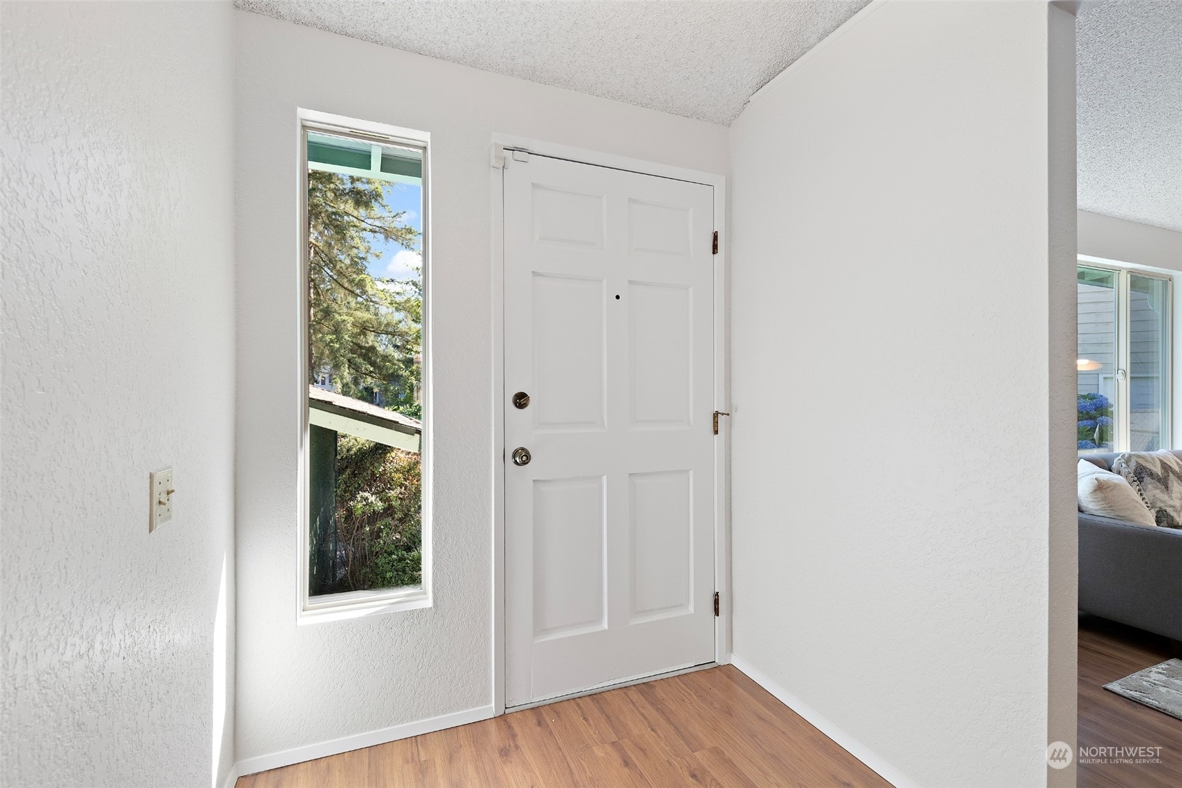 1229 206th Street Southeast Bothell, WA 98012 - Photo 4 of 40 a view of hallway with window and wooden floor