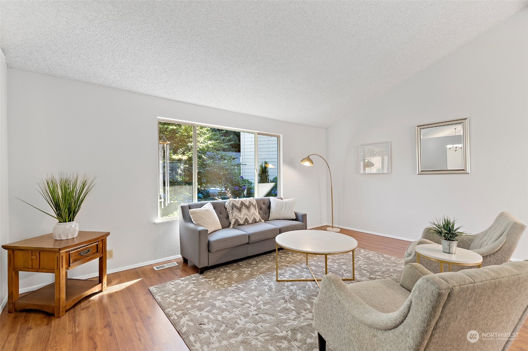 1229 206th Street Southeast Bothell, WA 98012 - Photo 6 of 40 a living room with furniture and a large window