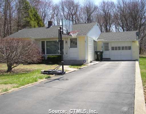 26 Maria Hotchkiss Road Prospect, CT 06712 - Photo 1 of 1 a front view of a house with a yard and garage