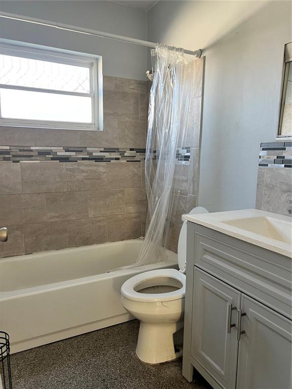5323 Carlton Road New Port Richey, FL 34652 - Photo 9 of 11 a bathroom with a toilet and a bathtub
