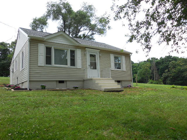 2371 Rutrough Road Southeast Roanoke, VA 24014 - Photo 2 of 34 a front view of a house with a garden
