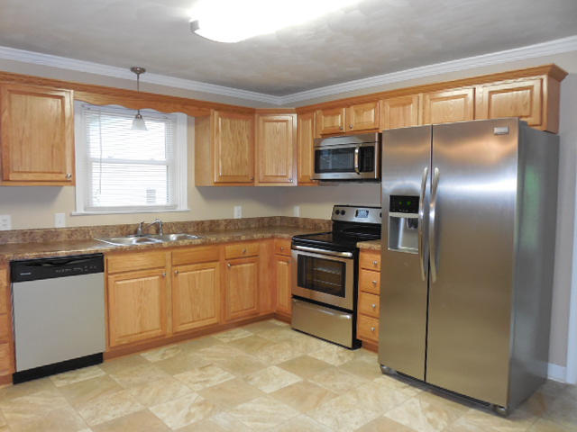2371 Rutrough Road Southeast Roanoke, VA 24014 - Photo 11 of 34 a kitchen with granite countertop a refrigerator and a sink
