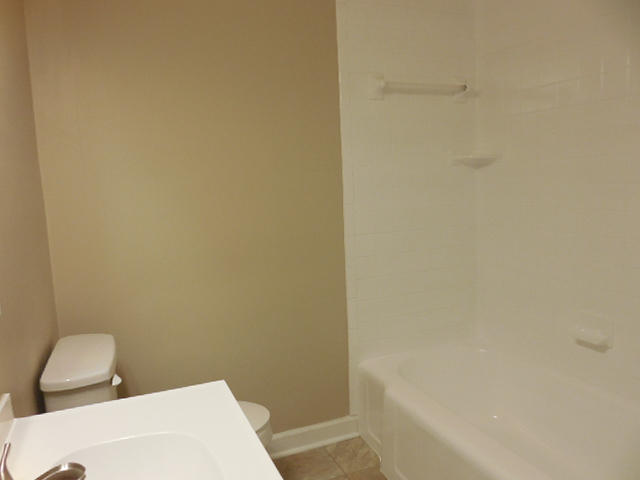 2371 Rutrough Road Southeast Roanoke, VA 24014 - Photo 15 of 34 a bathroom with a toilet and a tub