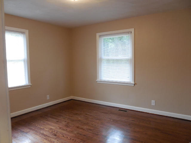 2371 Rutrough Road Southeast Roanoke, VA 24014 - Photo 17 of 34 a view of an empty room with wooden floor and a window
