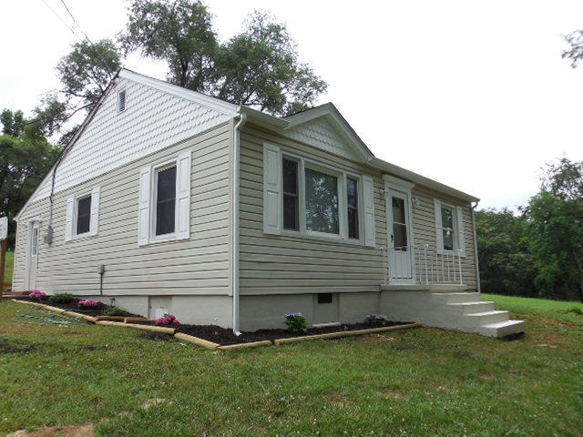 2371 Rutrough Road Southeast Roanoke, VA 24014 - Photo 3 of 34 a front view of a house with a yard