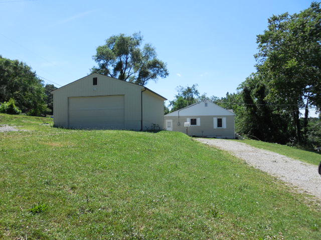 2371 Rutrough Road Southeast Roanoke, VA 24014 - Photo 32 of 34 a front view of a house with a yard and a garage