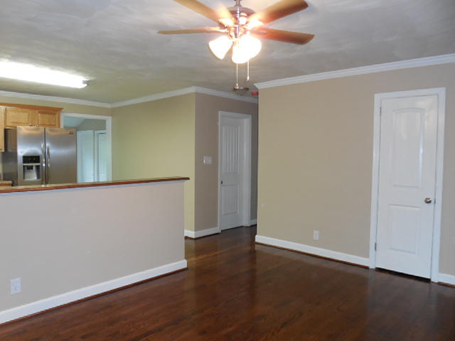 2371 Rutrough Road Southeast Roanoke, VA 24014 - Photo 6 of 34 an empty room with wooden floor chandelier fan and entryway