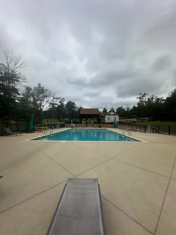 a view of an outdoor space and tennis court