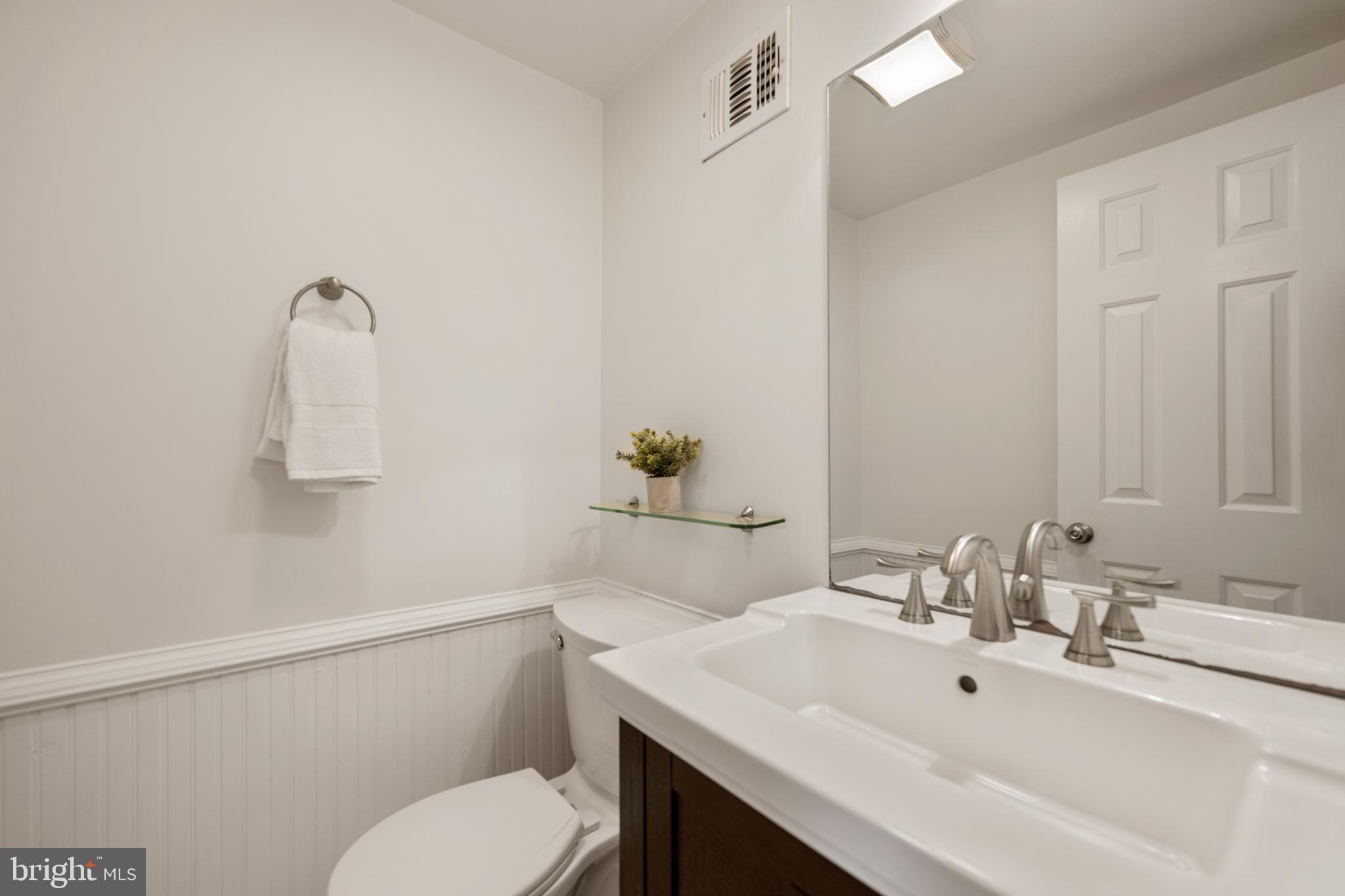 6800 Seton Court Springfield, VA 22152 - Photo 36 of 51 a bathroom with a sink mirror and toilet