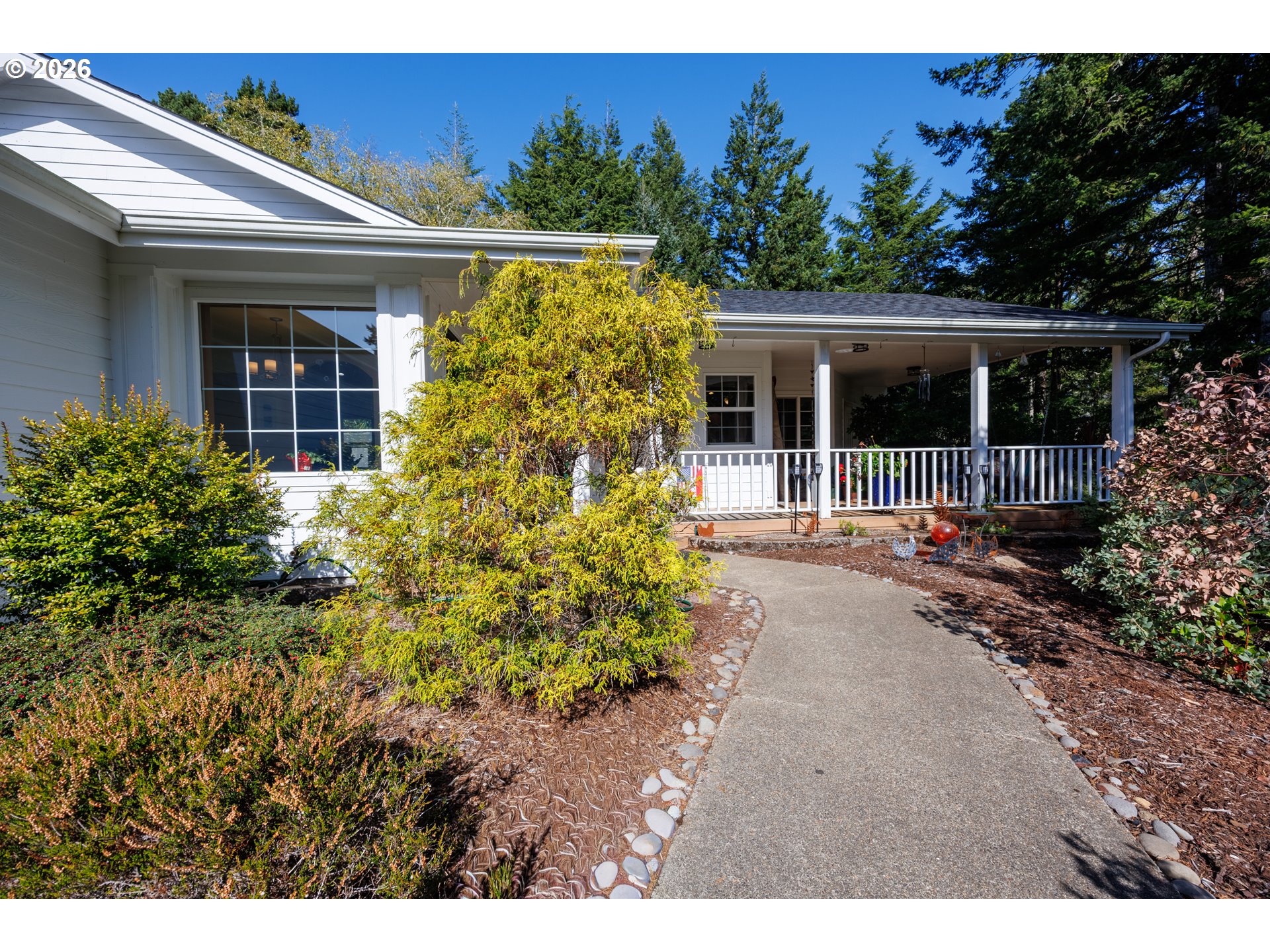 2193 13th Street Florence, OR 97439 - Photo 3 of 48 a view of a house with garden
