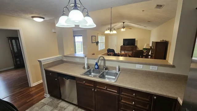 a bathroom with a sink a large mirror and vanity