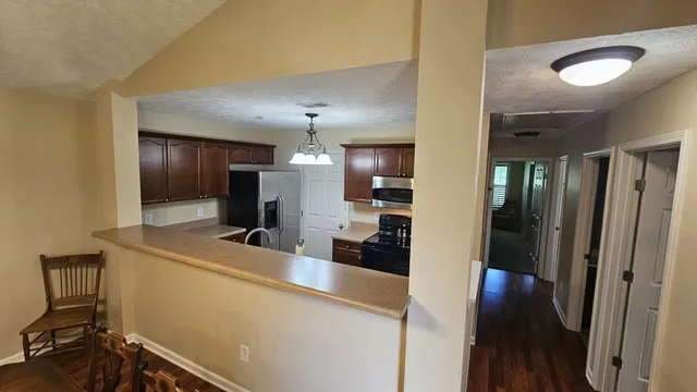 a view of a kitchen from a living room