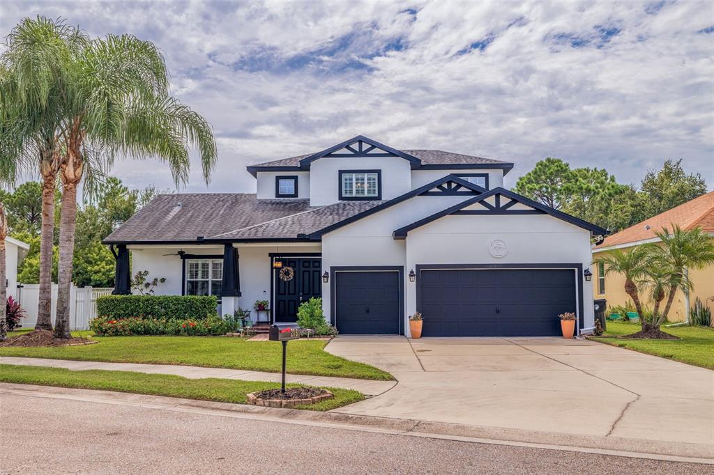 205 Bengal Circle Oldsmar, FL 34677 - Photo 1 of 40 a front view of a house with a yard and garage