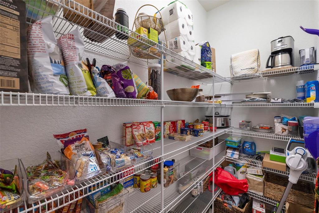 205 Bengal Circle Oldsmar, FL 34677 - Photo 14 of 40 a store room with lots of different colored cloths