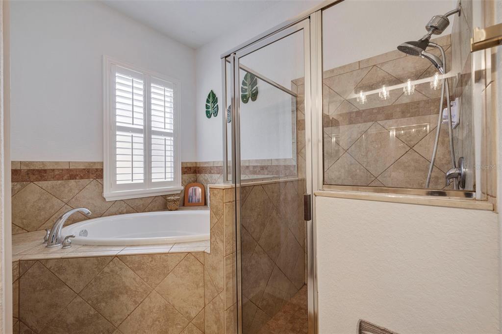 205 Bengal Circle Oldsmar, FL 34677 - Photo 17 of 40 a bathroom with a tub and shower