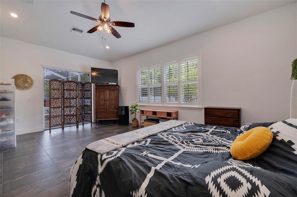 205 Bengal Circle Oldsmar, FL 34677 - Photo 20 of 40 a bedroom with a bed and wooden floor