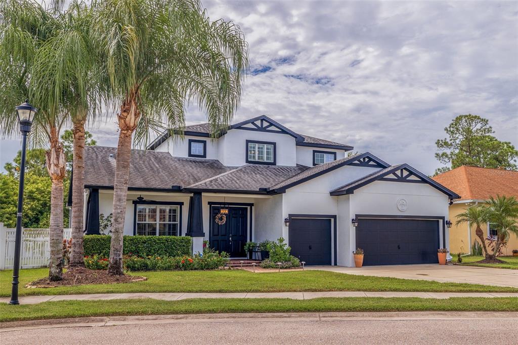 205 Bengal Circle Oldsmar, FL 34677 - Photo 2 of 40 a front view of a house with a yard