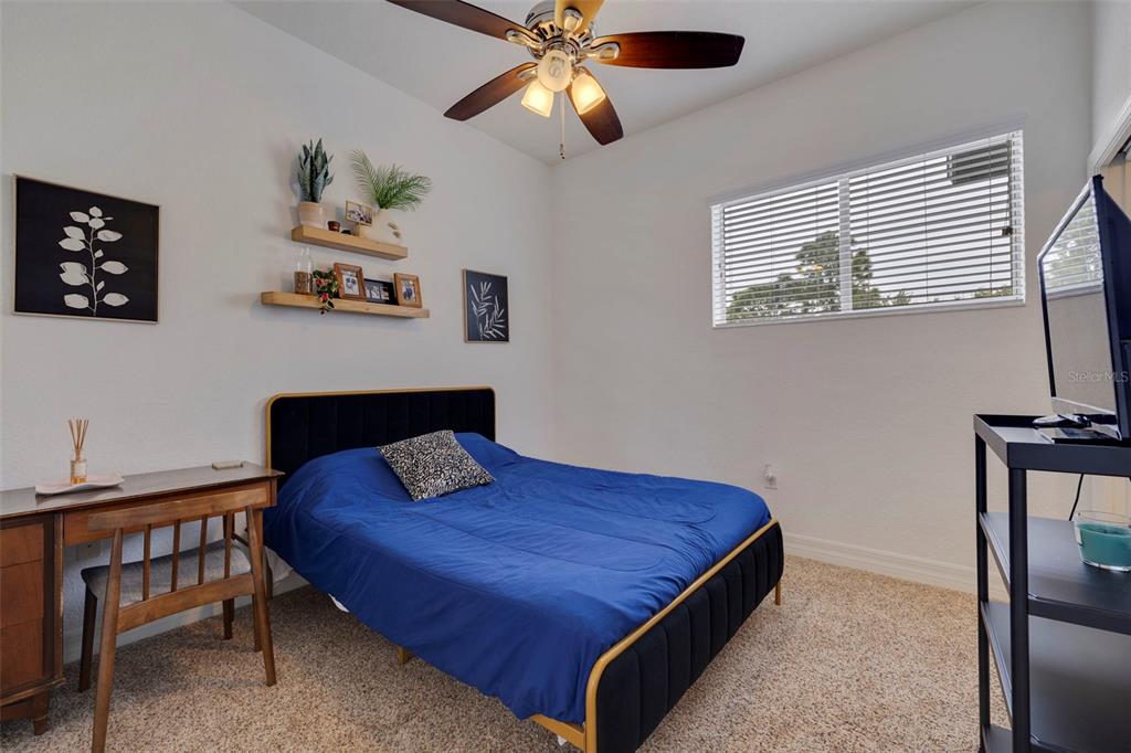 205 Bengal Circle Oldsmar, FL 34677 - Photo 22 of 40 a bedroom with a bed and a table