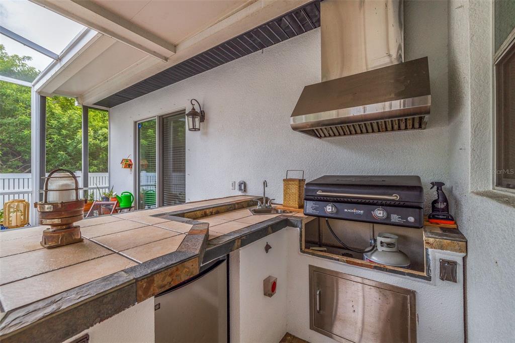 205 Bengal Circle Oldsmar, FL 34677 - Photo 7 of 40 a kitchen with a stove and a microwave