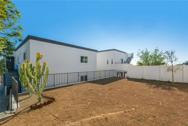 a view of backyard and tree