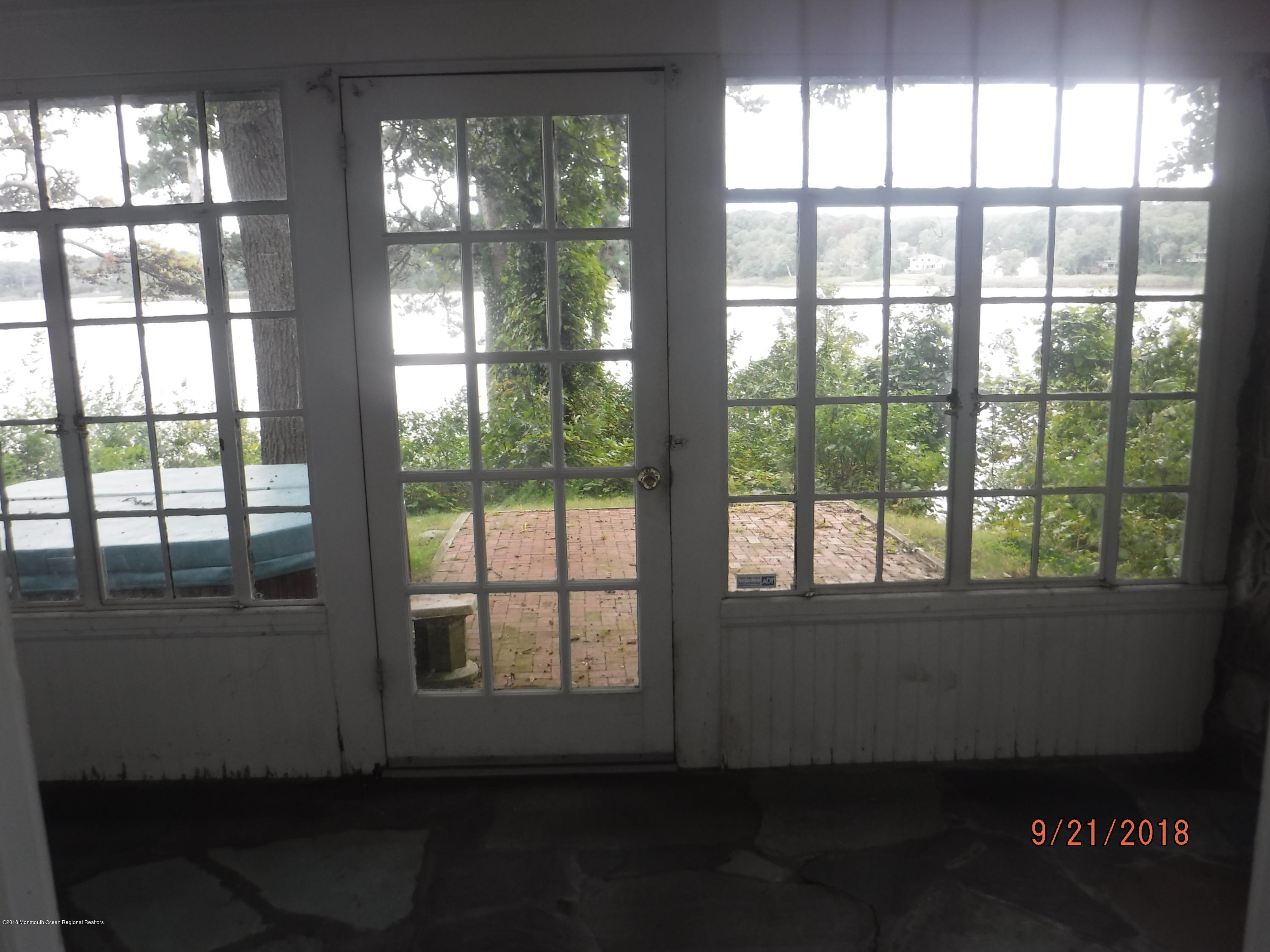 2413 Riverside Terrace Manasquan, NJ 08736 - Photo 20 of 46 enclosed porch with view of river
