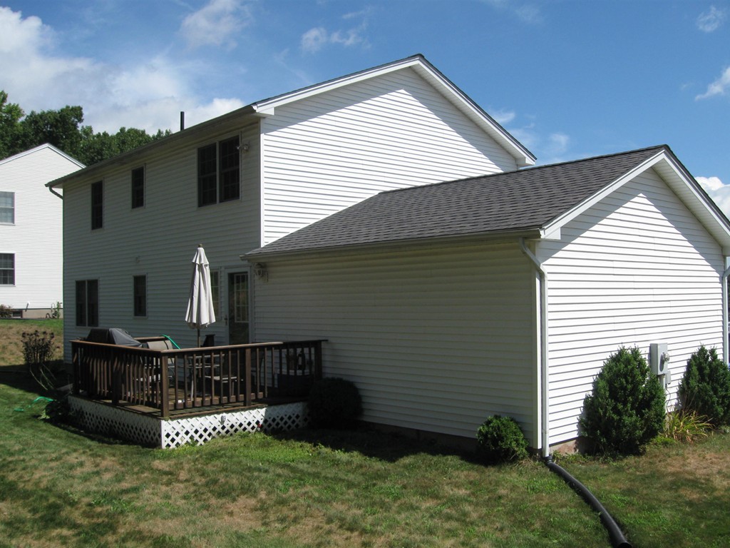 56 Gates Avenue Springfield, MA 01118 - Photo 2 of 30 a front view of house with yard and green space