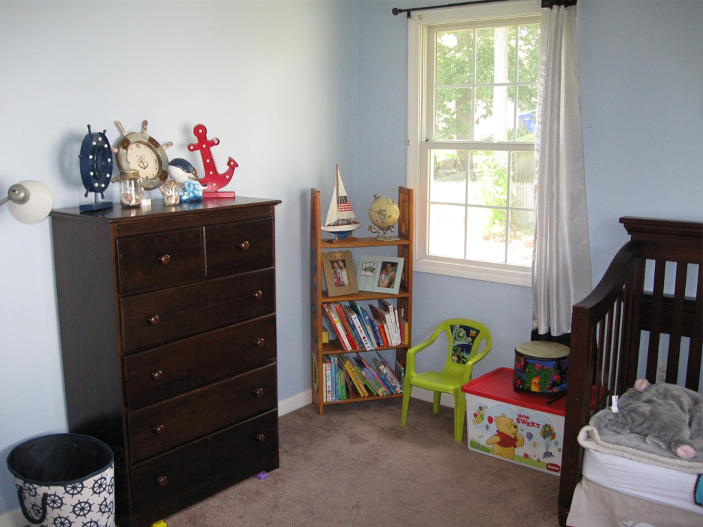 56 Gates Avenue Springfield, MA 01118 - Photo 21 of 30 a bedroom with a bed and a window
