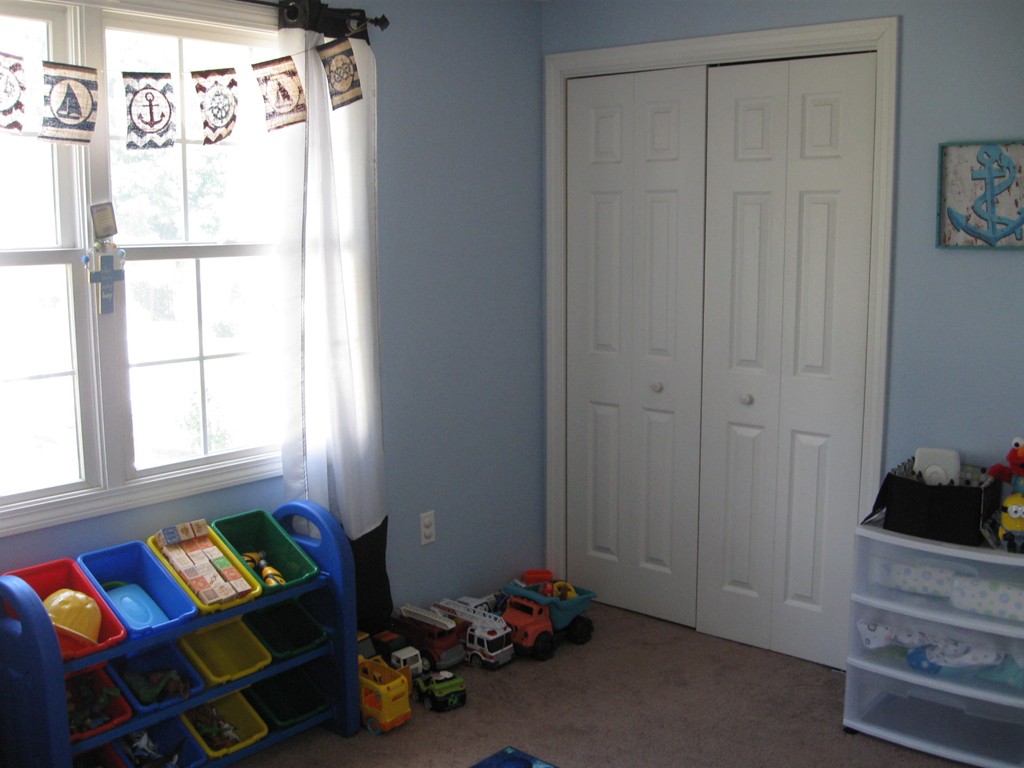 56 Gates Avenue Springfield, MA 01118 - Photo 22 of 30 a room with toys and a window