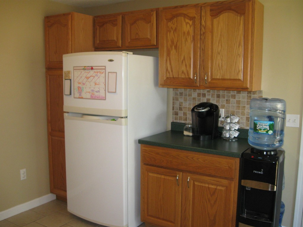 56 Gates Avenue Springfield, MA 01118 - Photo 8 of 30 a kitchen with stainless steel appliances granite countertop a refrigerator and a stove