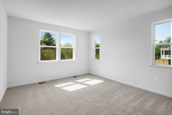 an empty room with windows